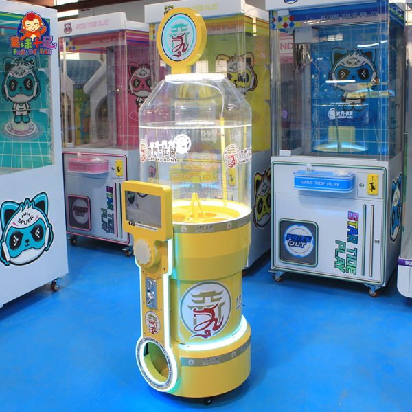 A colorful coin-operated capsule vending machine designed for all ages. The machine features vibrant graphics, a transparent display showcasing the capsules, and a coin slot for easy operation. Ideal for arcades, amusement parks, and retail stores, it offers a fun and engaging way to dispense surprise capsules.