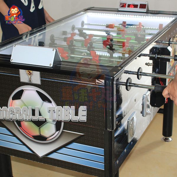 Coin-operated table football machine for kids and adults, perfect for arcades and entertainment venues.