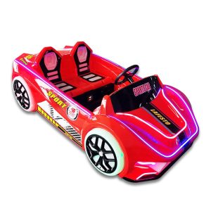 A colorful racing car kiddie ride designed for children, featuring bright colors and a sleek design, located in a playground setting.