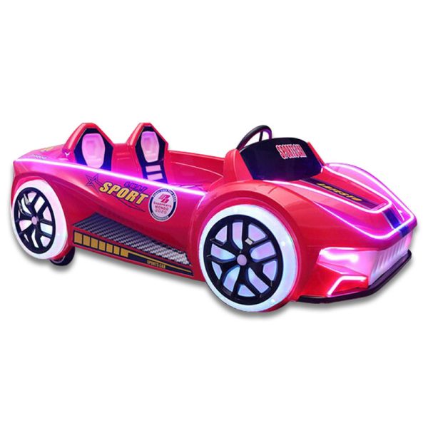 A colorful racing car kiddie ride designed for children, featuring bright colors and a sleek design, located in a playground setting.