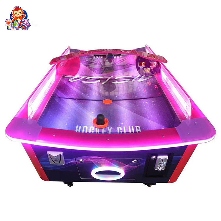 Curved air hockey table for competitive play.