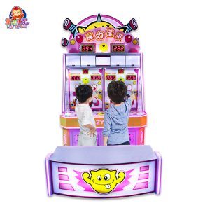 Child playing with the Magic Baby ball-shooting game machine in a colorful arcade.