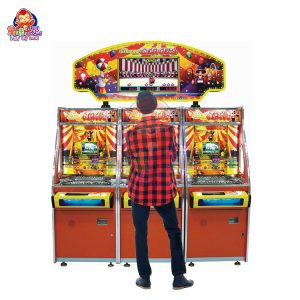 Three-player circus-themed coin pusher machine with vibrant lights and sound effects.