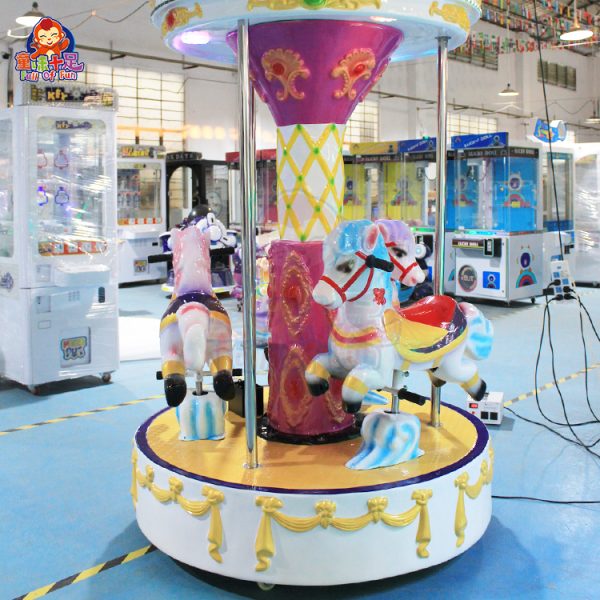 A colorful, coin-operated three-seater carousel ride for kids.